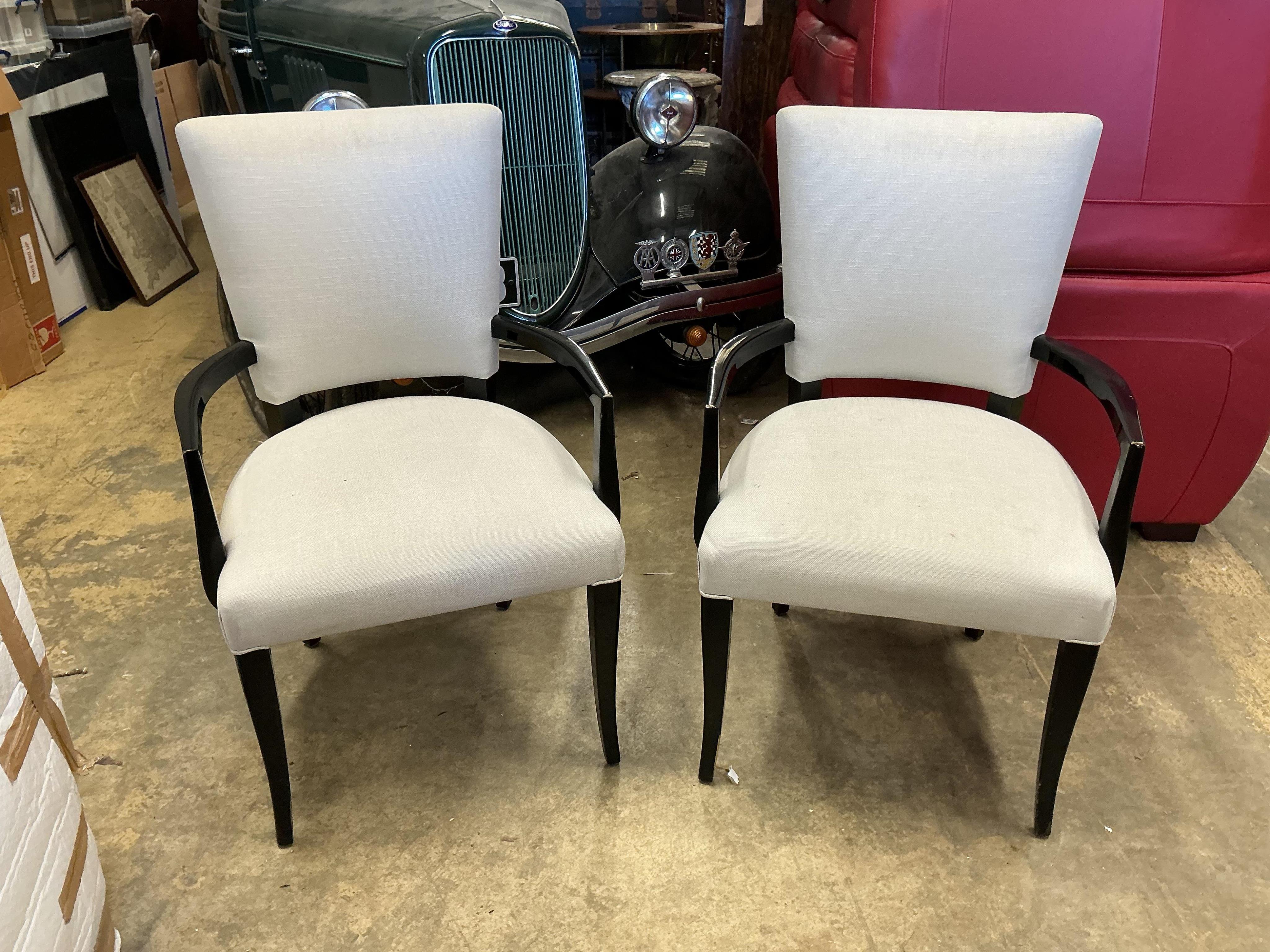 Seven contemporary ebonised and grey fabric elbow chairs, five with arms